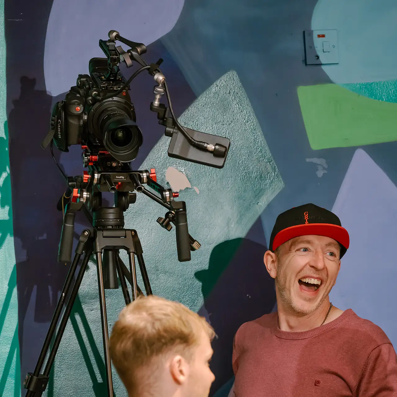 Code Brown cinematographer laughing with the film crew