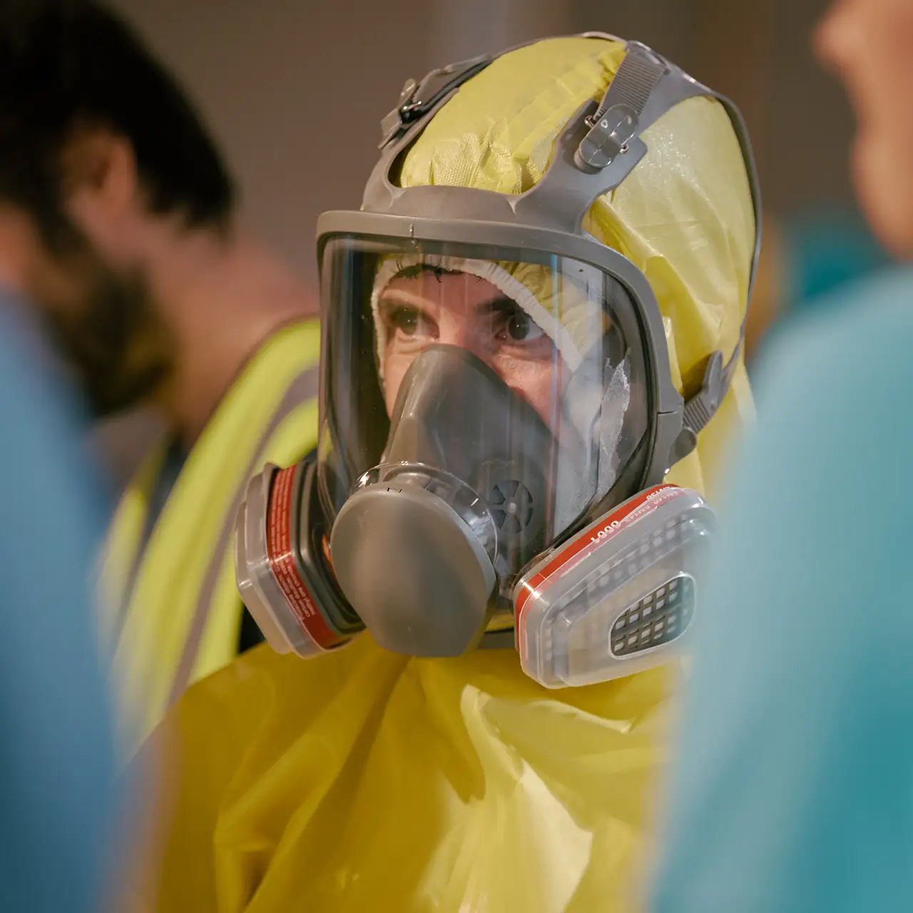 a man in a yellow hazmat suit